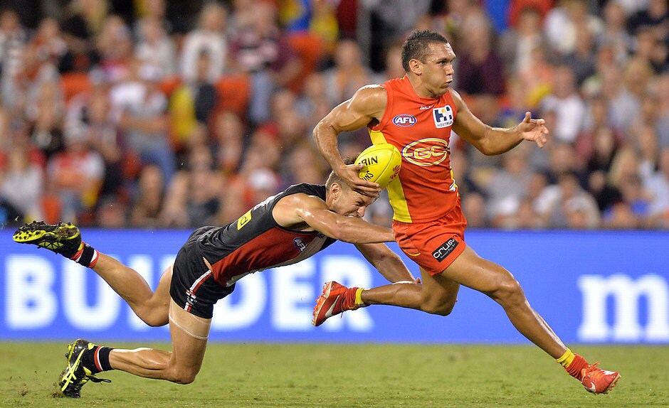 AFL 2015 Rd 02 - Gold Coast v St Kilda Harley Bennell of the Suns and Sean Dempster of the Saints compete for the ball during the 2015 AFL Round 02 match between the Gold Coast Suns and the St Kilda Saints at Metricon Stadium, Gold Coast on April 11, 2015. (Photo: Bradley Kanaris/AFL Media)
